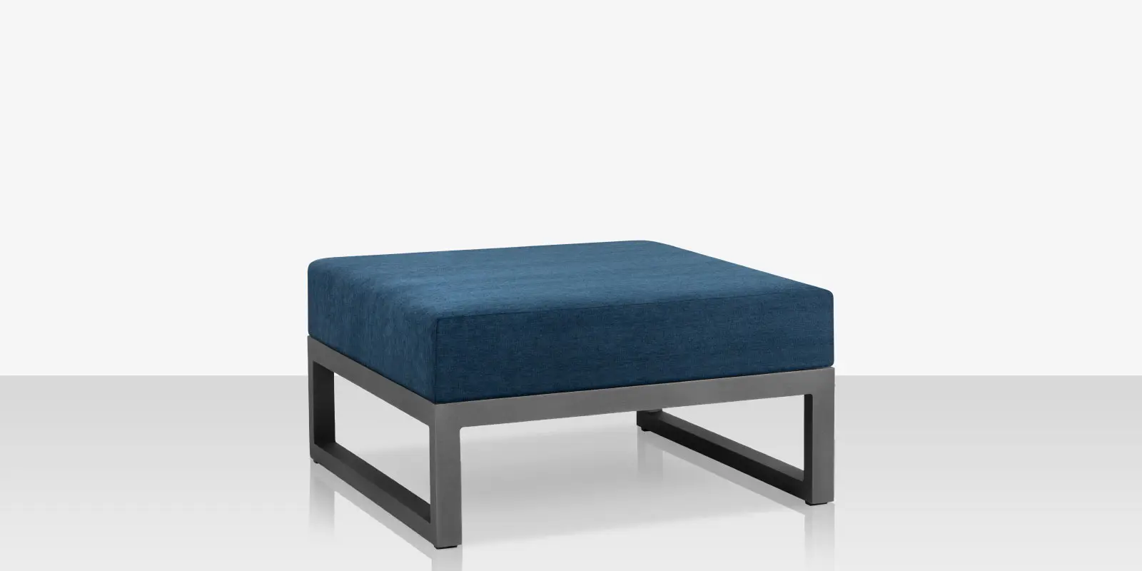 05_iconic_silver_blue_ottoman_angle_03.webp