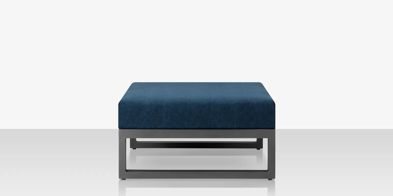 04_iconic_silver_blue_ottoman_side.webp