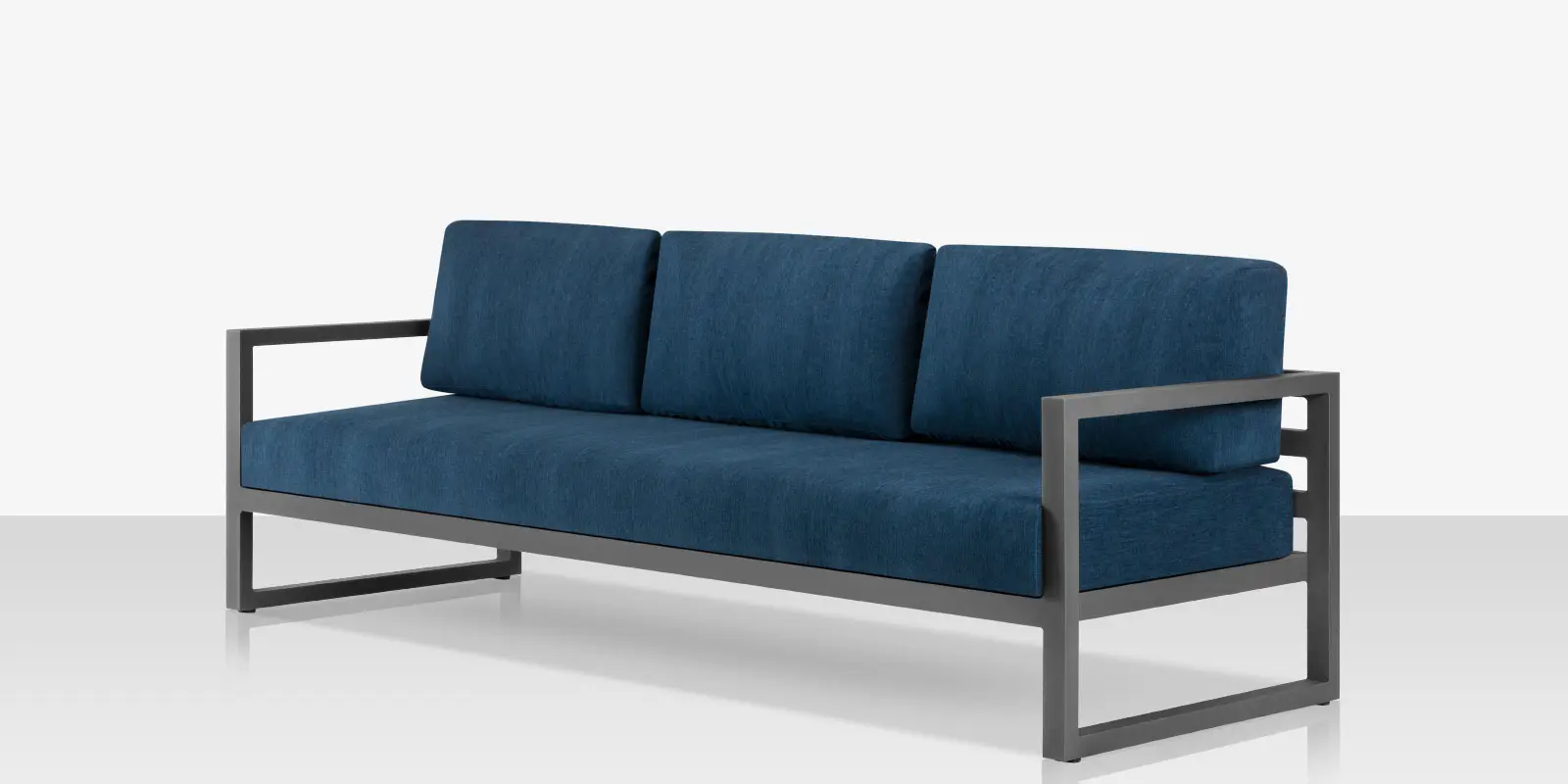 09_iconic_silver_blue_sofa_angle_02.webp